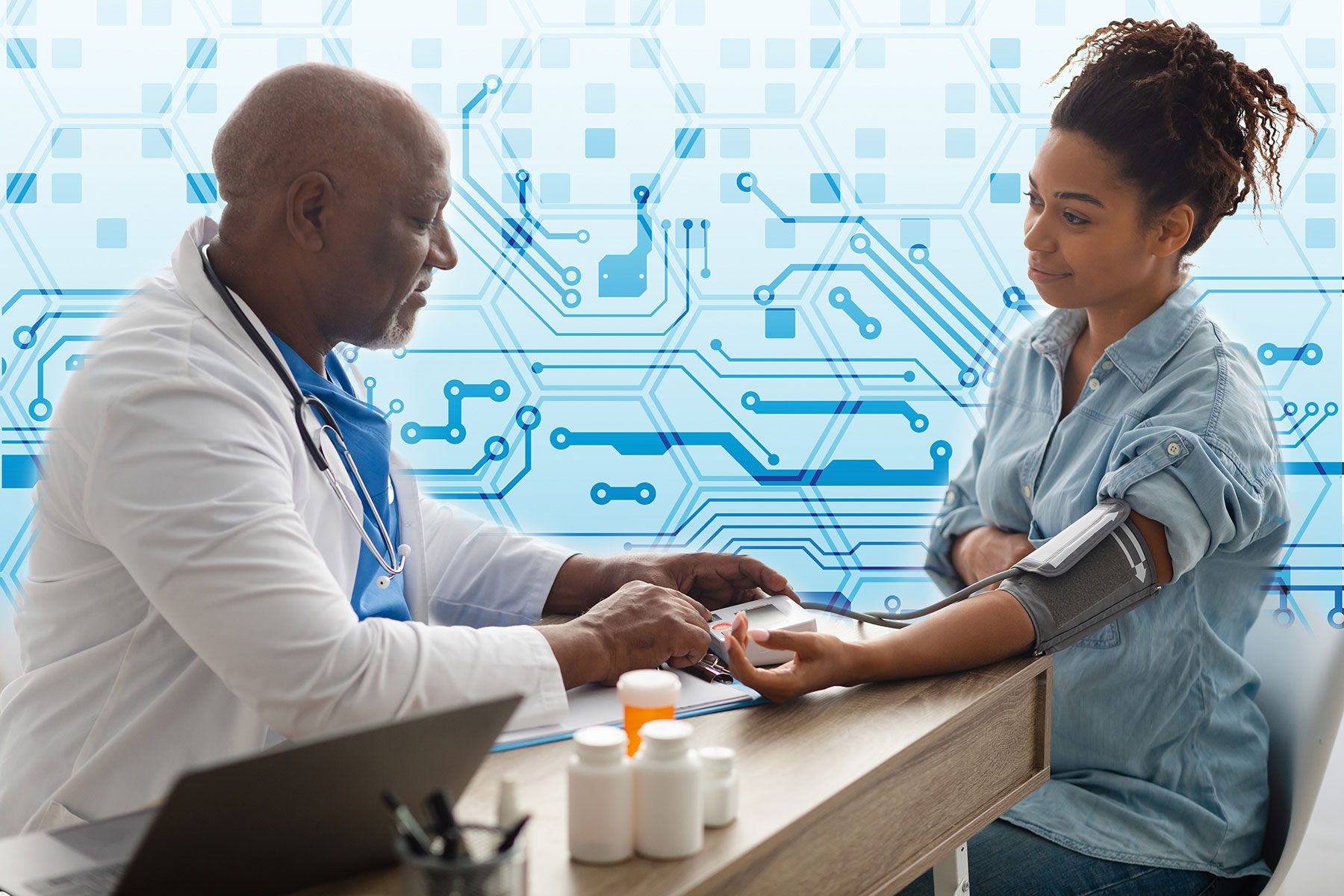 Doctor checks pregnant woman's blood pressure.