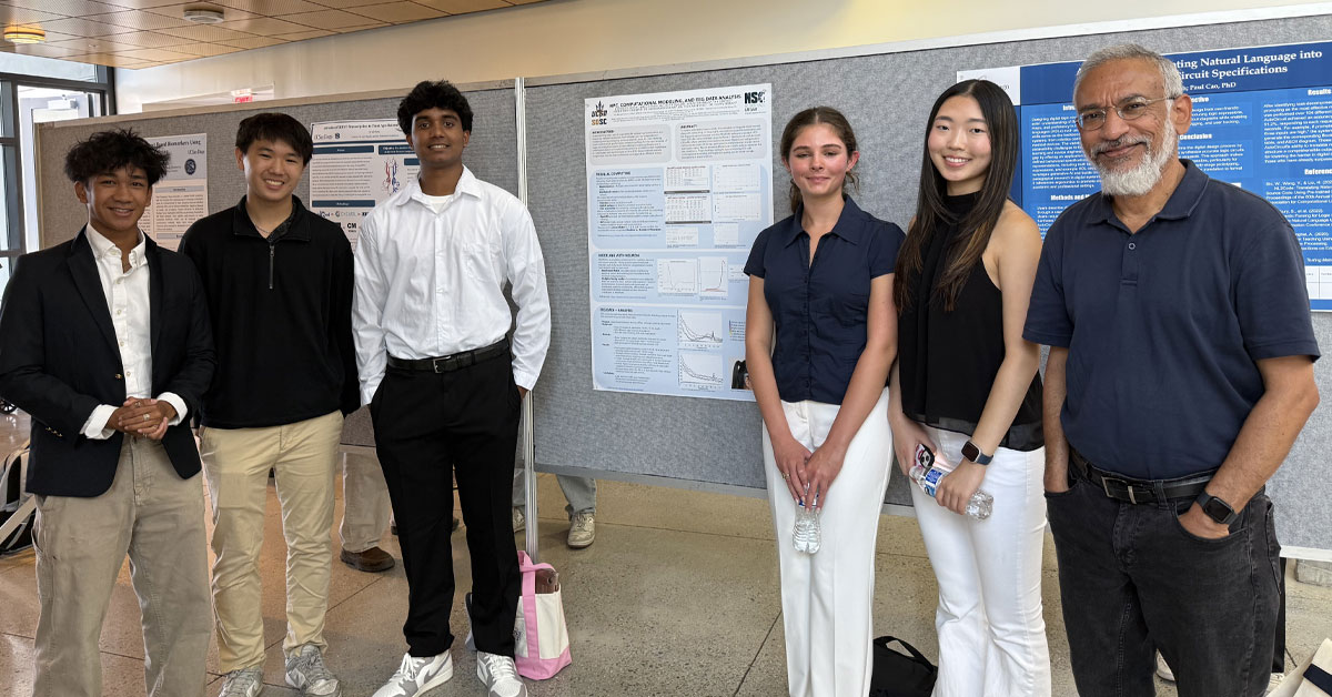 High school students present poster with SDSC research mentor
